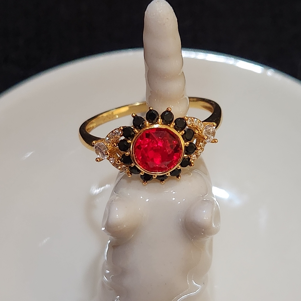 Elegant Gold Ring with Red Gemstone